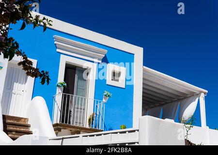 Creative perspective a modern blue and white single-story building on a clear sky Stock Photo