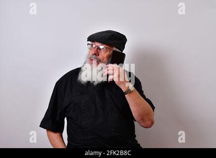 Senior man talking on the smartphone Stock Photo