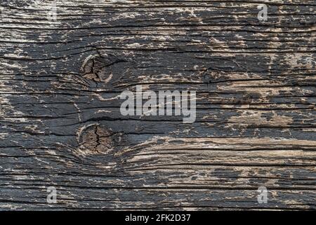 Old wooden background textured surface with peeling black paint. Abstract texture Stock Photo