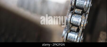 Rusty and worn out bike chain closeup banner, bike repair concept photo Stock Photo