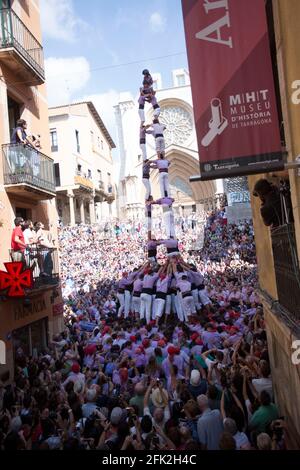 Tarragona, Spain, September 19, 2019 - Human Castells Tower on crowd of tourists