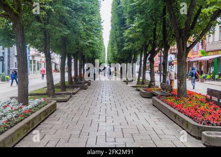 KAUNAS, LITHUANIA - AUGUST 16, 2016: People walk along Laisves aleja street in Kaunas, Lithuania Stock Photo