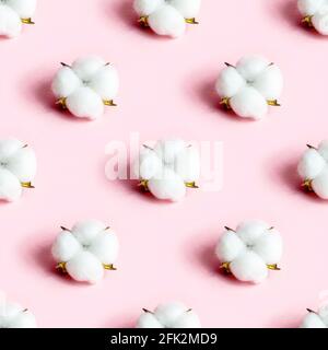 White dry cotton flowers seamless pattern on light pink background. Stock Photo