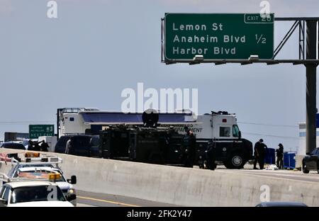 (210428) -- LOS ANGELES, April 28, 2021 (Xinhua) -- Police officers investigate at the scene where the gunman was killed in Fullerton shootout in Los Angeles, California, the United States, April 27, 2021. A gunman, suspected of killing two and wounding another in a series of drive-by shooting incidents in Los Angeles, was killed by police Tuesday morning after about five hours' chase and exchange of fire. According to Raul Jovel, an officer from the Los Angeles Police Department (LAPD)'s Media Relations Division, the shooter's rampage occurred from 0:55 a.m. to 1:25 a.m. local time, when Stock Photo