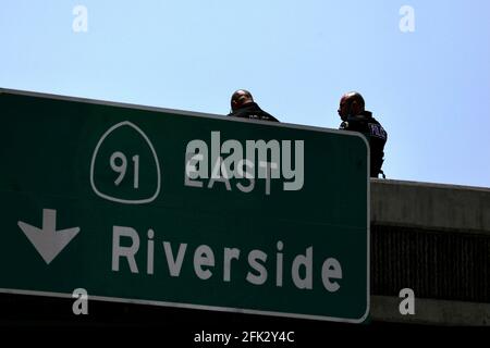 (210428) -- LOS ANGELES, April 28, 2021 (Xinhua) -- Police officers investigate at the scene where the gunman was killed in Fullerton shootout in Los Angeles, California, the United States, April 27, 2021. A gunman, suspected of killing two and wounding another in a series of drive-by shooting incidents in Los Angeles, was killed by police Tuesday morning after about five hours' chase and exchange of fire. According to Raul Jovel, an officer from the Los Angeles Police Department (LAPD)'s Media Relations Division, the shooter's rampage occurred from 0:55 a.m. to 1:25 a.m. local time, when Stock Photo