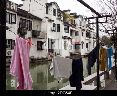 Suzhou, China - March 23, 2016: Laundry drying outside in Suzhou old town along the water canals Stock Photo