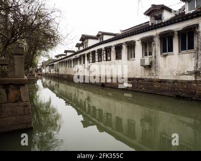 Suzhou, China - March 23, 2016: White walled houses along the canals in Suzhou old town Stock Photo