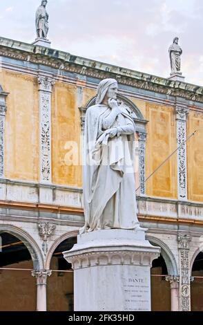 The monument to Dante Alighieri in front of the medieval building of Loggia del Consiglio (municipal council), located in Piazza dei Signori square, V Stock Photo