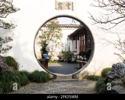 Suzhou, China - March 21, 2016: Round gate in classical Master of the Nets Garden Stock Photo