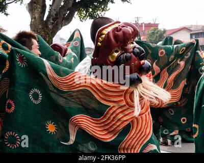 Takayama, Japan - October 10, 2015: Lion dance performers marching the streets during the annual Takayama Autumn Festival Stock Photo