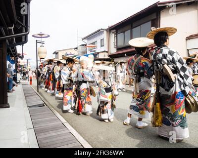 Takayama, Japan - October 10, 2015: Local children in traditional costumes marching the streets of historic Takayama during the annual Takayama Autumn Stock Photo