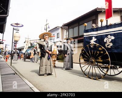 Takayama, Japan - October 10, 2015: Local people in traditional costumes marching the streets of historic Takayama during the annual Takayama Autumn F Stock Photo