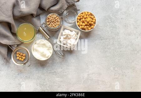 Vegan cooking concept. Meringue from canned chickpea water aquafaba. Healthy product. Eggs replacement and substitute. Top view, copy space for recipe Stock Photo