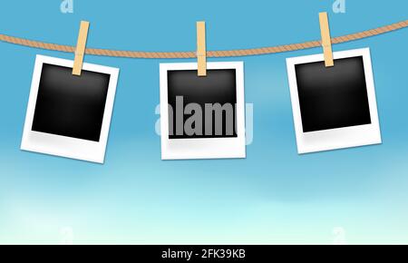 Photo frames hanging on the rope with wood pins on sky background Stock Vector