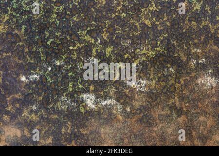 Old paper with green and brown faded and worn abstract design texture background Stock Photo