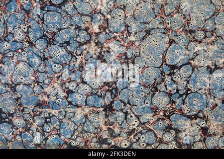 Old decorated paper with blue, red and black abstract faded design texture background Stock Photo