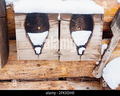 Worn out and burnt wooden glass molds. Stack of used wooden glass shaping tools and moulds to be used when blowing glass. Stock Photo