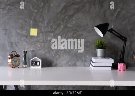 Cropped shot of minimal workspace with mock-up laptop, smartphone, decorations and copy space, work from home concept Stock Photo