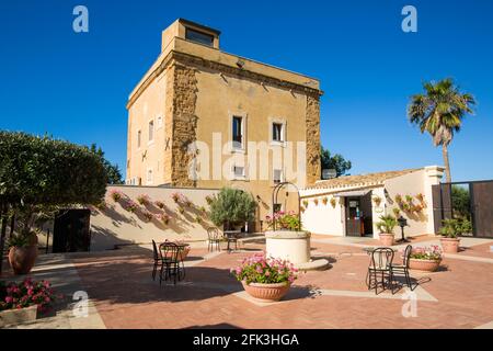 Agrigento, Sicily, Italy. View across sunlit courtyard of the historic Baglio della Luna boutique hotel. Stock Photo