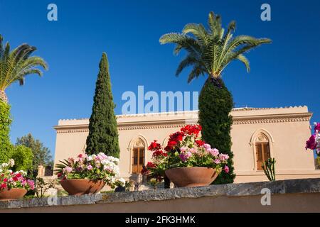 Agrigento, Sicily, Italy. View from below to façade and colourful gardens of the Villa Aurea, Valley of the Temples. Stock Photo