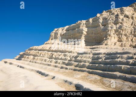 Realmonte, Agrigento, Sicily, Italy. White limestone cliffs of the Scala dei Turchi lit by the rising sun. Stock Photo