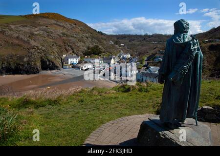 Llangrannog Beach at low tide and village with statue of Saint Crannog, Cardigan Bay, Cardigan, Wales, UK Stock Photo