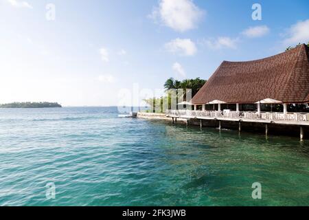 Waterfront restaurant at Bandos Island in the Maldives. The Maldives is a popular holiday tropical destination in the Indian Ocean. Stock Photo