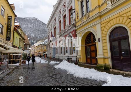 Shoppers amidst spring snow in the Historic Centre of Brasov Romania - Photo: Geopix Stock Photo
