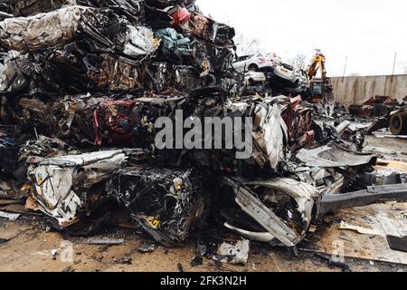 Scrapped cars crushed in vehicle recycling centre Stock Photo