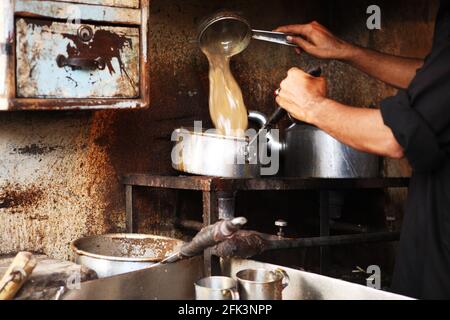 Dirty traditional Pathan’s chai cafe in a market place in Karachi Stock Photo