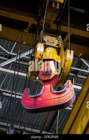 Abstact industrial background. Close-up photo of overhead crane hook. On factory or plant. Stock Photo