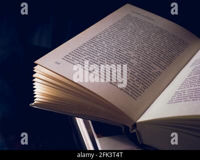 Open Book On Dark Background Stock Photo