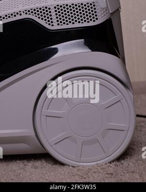 Electrical engineering. Washing vacuum cleaner wheels. Gray wheel. A close up of a toy. Stock Photo