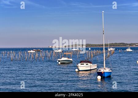 Oyster farming and boats at Cap-Ferret, a commune is a located on the shore of Arcachon Bay in the Gironde department in Aquitaine in France Stock Photo