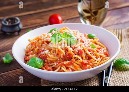 Spaghetti alla Amatriciana with guanciale, tomatoes and pecorino cheese. Italian healthy food. Stock Photo