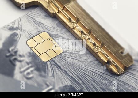 The perforated key on the credit card next to the chip. Data encryption and security concept Stock Photo