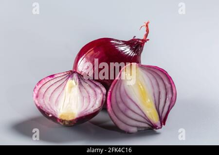 Red onions isolated on gray background. Stock Photo