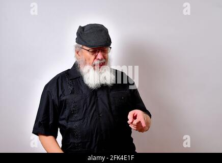 Senior man repulsed by what he finds Stock Photo