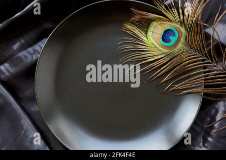 Black template black copy space with peacock feather. Elegant premium mock up background. High quality photo Stock Photo