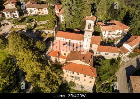 Aerial view of the Parish Church of Sant Appiano in ancient village Castello Cabiaglio, situated in province of Varese, Lombardy, Italy Stock Photo