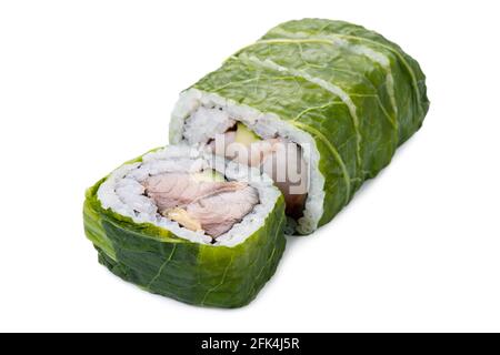 sushi rolls with mackerel, wrapped in green leaves isolated on white background, Asian food, traditional Japanese food Stock Photo