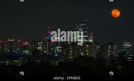 Celestial Event in spring as the super pinkmoon rises over London. Stock Photo