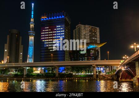 Tokyo, Japan, June 9, 2020: Night scene of famous landmark Tokyo Skytree, Asahi Tower, Sumida River. The Asahi Beer Brewery Headquarters.  During covi Stock Photo