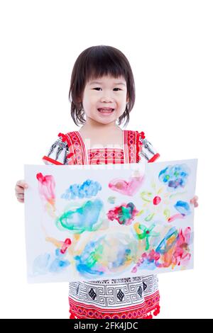 Little asian (thai) girl showing her artwork, isolated on white background, some space for input text message, success learning education concept, stu Stock Photo
