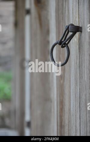 Close-up of rustic handle on old wooden doors. Byeongsan Seowon, Andong, South Korea.