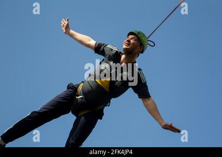 03 June 2018 Belarus. Gomil. Rope Jumping. A man jumps from a bridge on a rope. Extreme sports. Stock Photo