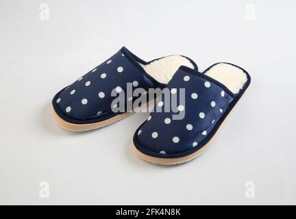 Blue and white polka dots house slippers isolated on white background Stock Photo