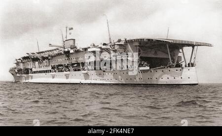 The aircraft carrier HMS Glorious, built as a large light cruiser in 1915-1917, she was converted, 1924-1930.  From British Warships, published 1940 Stock Photo