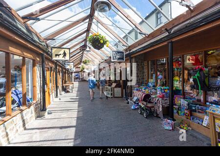 Interior of Great Torrington Pannier Market, Shops and Glass Roof Detail Looking Towards the Main Town Entrance and Torrington Square #2 Stock Photo