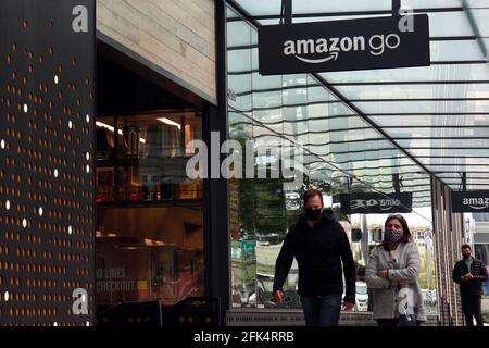People walk past an Amazon Go store in Seattle. The ecommerce company is due to announce its quarterly earnings on 29th Apr 2021. (Photo by Toby Scott / SOPA Images/Sipa USA) Stock Photo